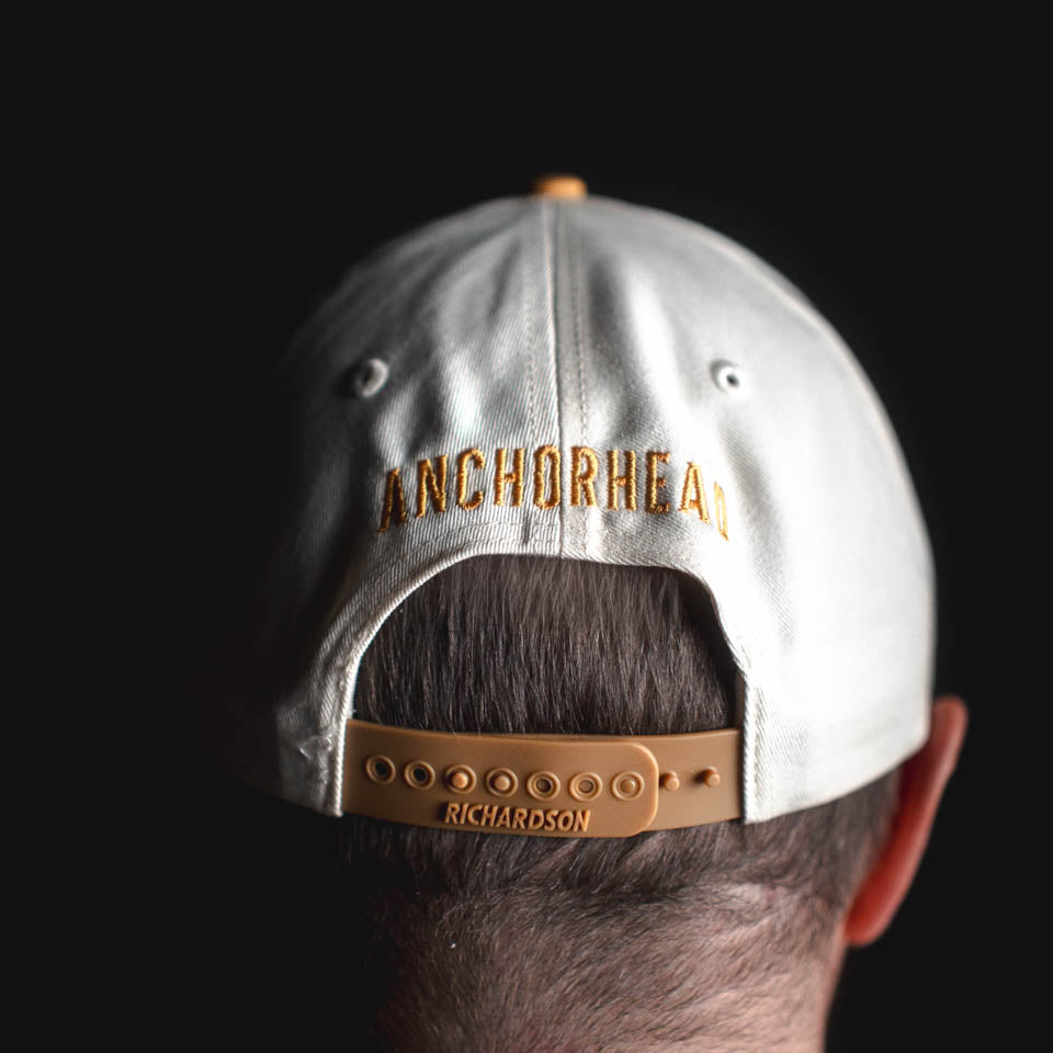 Back view of a cap with 'Anchorhead' branding on a black background