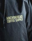 Black jacket with 'Anchorhead Coffee Supply' text in yellow on a dark background