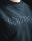 Dark gray sweatshirt with 'ANCHORHEAD' text on a black background