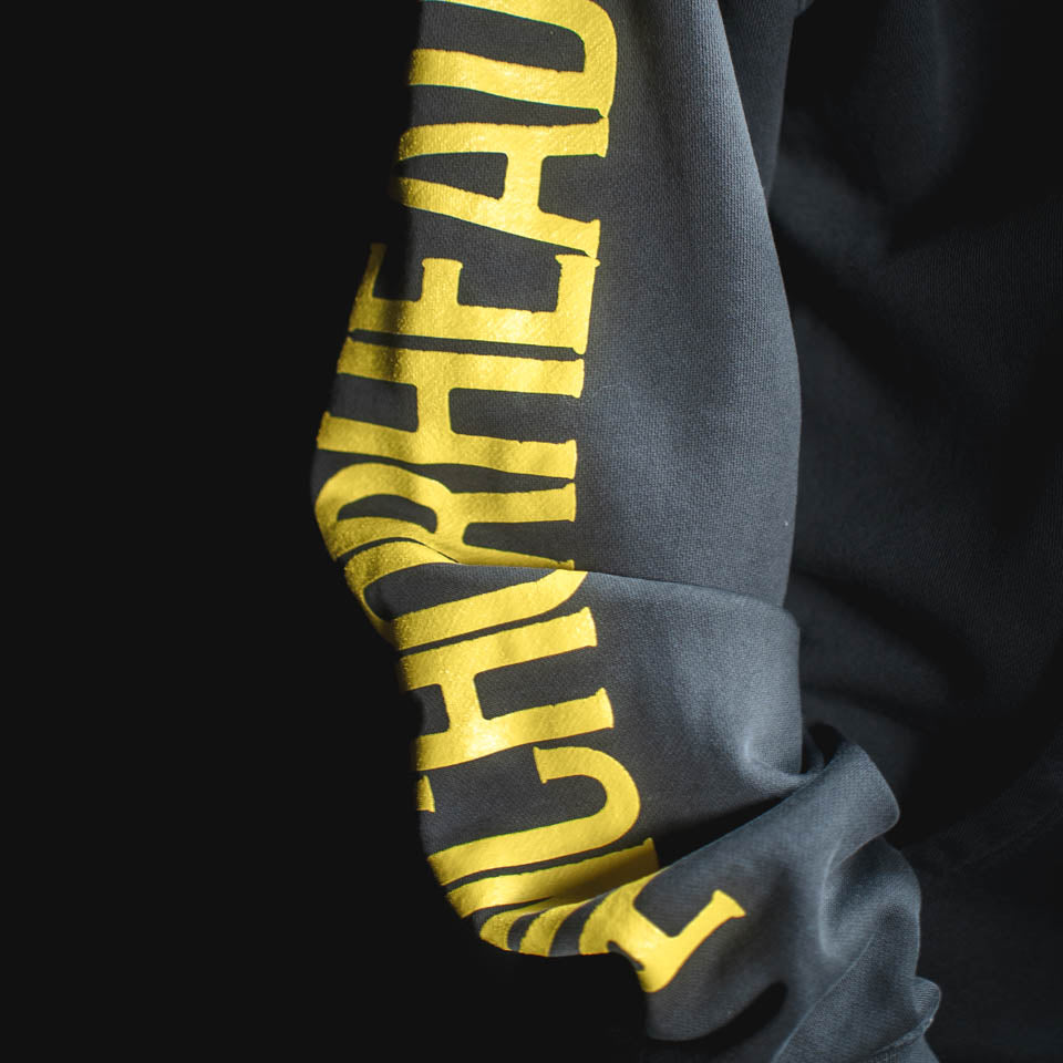 Gray sweatshirt with yellow text on a black background