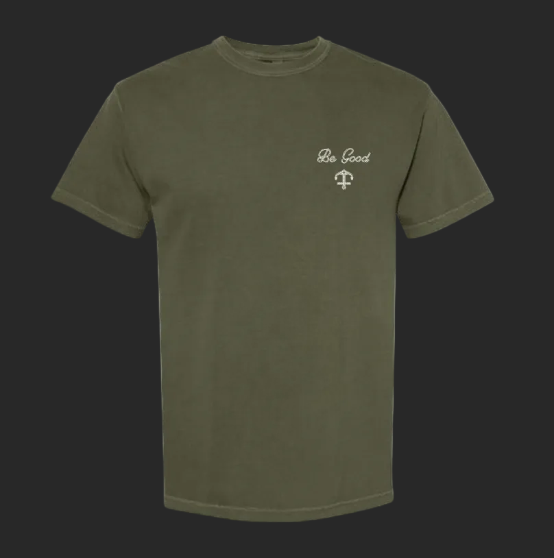 Green crew neck t-shirt with 'Be Good' text and a small logo on the chest.