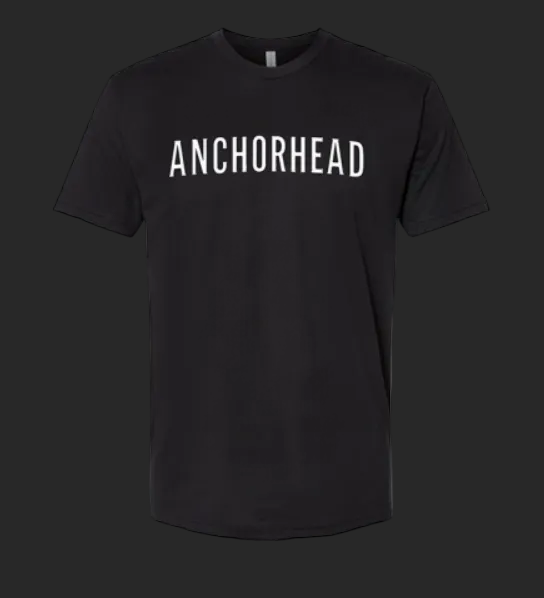 A black t-shirt with 'ANCHORHEAD' printed on it against a dark background